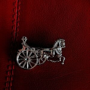 Silver horse brooch